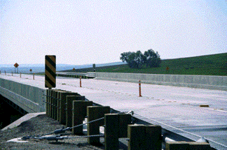 Figure 29. Photo. Bridge Deck Overlay in Lyman County, SD. This photo shows the two-lane bridge and railings.