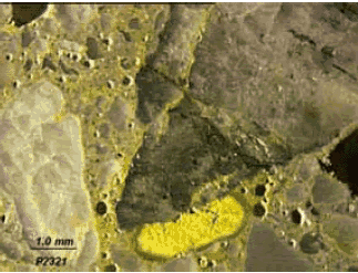 Potassium in secondary deposits in void and paste are stained yellow.