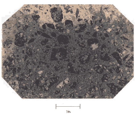 In this view, the majority of the paste is dark greenish gray while a small section on the top is a lighter beige color.