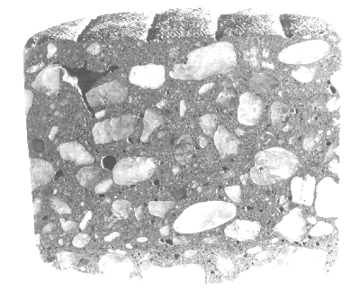 The top section of a concrete core is shown with a crack and void noticeable below a surface layer of mortar leaving a void about 10 millimeters below the finished concrete surface.