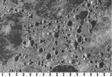 The concrete surface shown can be characterized by a high number of large voids (in the 0.5 to 1.0 millimeter range). Such large voids do not add to the resistance of the concrete to cycles of freezing and thawing but do lower the compressive strength.