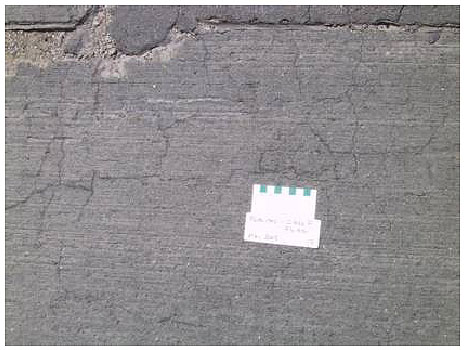 Figure 20.  Photo. Section with Class F Fly Ash and Placitas-May 2001.  Some cracking is visible, but it is less dense than in the control section or the class C fly ash sections from 1999.