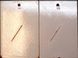 Figure 7. b Panel pictures. [Coating conditions of system 1 after exposures. A. 3,000-hour test A  B. 3,000-hour test B  C. 2-year outdoor exposure]  This figure shows the coating conditions of system 1 (zinc-rich epoxy system) after three tests. No surface failure was observed in all cases. The system developed a small amount of creepage at scribe after test A and test B but none after the outdoor exposure.
