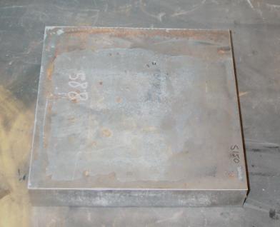 Photograph of the SDHTB.  Color Photograph. Companion to figure 21. The figure is a color photograph of the test block described in figure 21. The photograph shows the hole as well as the thickness of the block.