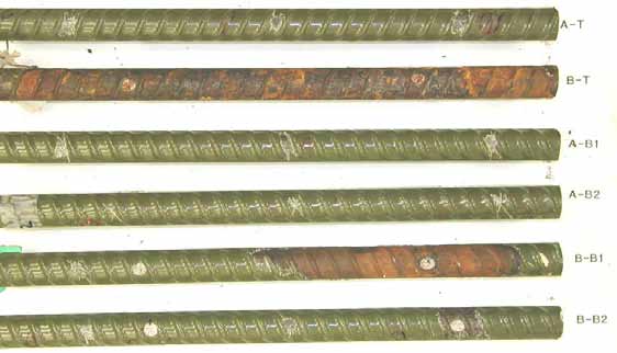 Figure 50. Slab #2 after autopsy. Photo. After autopsy, a top mat ECR labeled B-T shows significant delamination and corrosion on the substrate. The right half of the fifth bar down (B-B1) shows a similar corrosion pattern. The remaining bars show good condition.