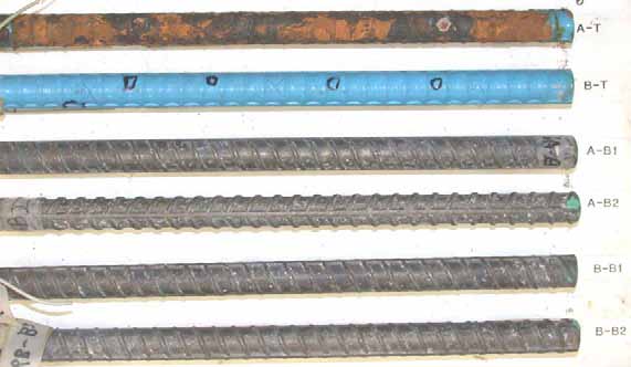 Figure 62. Slab #6 after autopsy. Photo. After autopsy, a top mat ECR (A-T) is completely delaminated with significant substrate corrosion and the other top mat ECR (B-T) still looks very good without noticeable coating damage. The cleaned bottom mat four black bars look good.