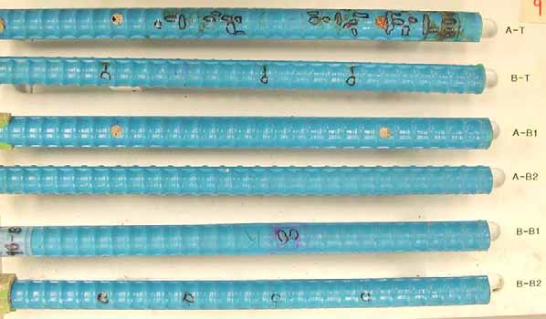 Figure 70. Slab #9 extracted rebars condition. Photo. Before autopsy, the straight ECRs show good condition except that a top map ECR (A-T) shows major blistering and significant coating deterioration. 