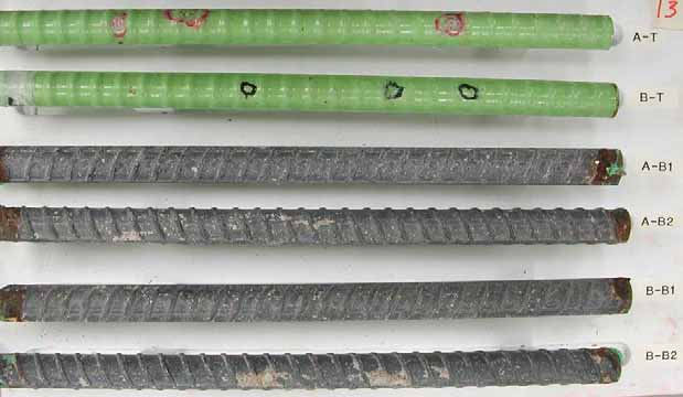 Figure 82. Slab #13 extracted rebars condition. Photo. Before autopsy, the top mat two straight ECRs (A-T and B-T) look good. The bottom mat four black bars are corrosion free except at the ends.