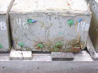 Figure 84. Slab #14 front, rear, and top views with specifications. Photos. (A) Slab number 14 front view shows the 14A label on the left and 14B on the right. The green bars and the concrete have major cracks and corrosion around the bottom bars. Wires connect the top and bottom bars of 14B; the same is true for 14A. 