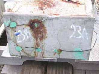 Figure 111. Slab #23 front, rear, and top views with specifications. Photos. (A) Slab number 23 front view shows the 23B label on the left and 23A on the right. The top right bar shows severe corrosion and major cracks radiate from all the bars. Wires connect the top left and bottom bars of 23B and just the lower bars for 23A. 