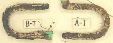 Figure 112. Slab #23 extracted rebars condition. Photo. Before autopsy, both of the top mat bent black bars and all the bottom mat straight black bars are severely corroded.