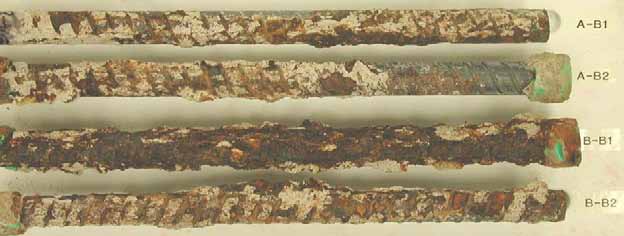 Figure 112. Slab #23 extracted rebars condition. Photo. Before autopsy, both of the top mat bent black bars and all the bottom mat straight black bars are severely corroded.