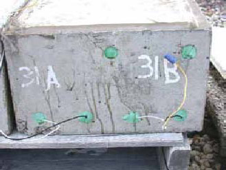 Figure 135. Slab #31 front, rear, and top views with specifications. Photos. (A) Slab number 31 front view shows the 31A label on the left and 31B on the right. The concrete surface shows minor cracks and corrosion drips. Wires connect the top and bottom bars of 31B and only the bottom bars for 31A. 