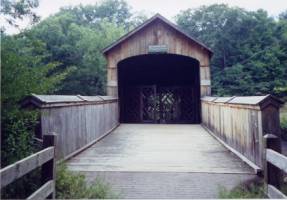 This picture is an example of a timber truss span with deck surface exposed to the weather, also known as a 