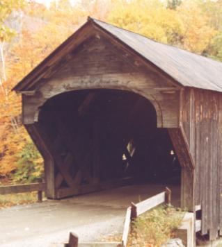 The portal is the opening or entranceway to a bridge at the end elevation and represents nonstructural detailing. This picture shows unusual finishing similar to a house with an arch and diagonal panels attached to the Town lattice structure.