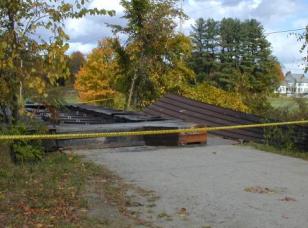 This picture shows the entrance to a bridge where only the floor beams remain. The sides and roof have been blown away, again after alterations to the overhead bracing system.