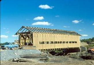 This longitudinal view shows the bridge set on the abutments with the walls tied together with the roof trusses and horizontal purlins or tie beams.