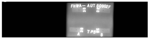 The radiographic image does not show any rejectable discontinuities along the weld length.