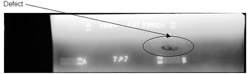 The radiographic image shows one longitudinal discontinuity. The discontinuity is located between markers A and B and is circled for illustrative purposes.