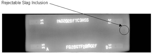 The radiographic image shows one discontinuity (slab inclusion) to the right of marker B. The discontinuity is circled for illustrative purposes.