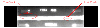 Figure 10. Photo. Laboratory specimen S033: Radiographic image shows the two implanted cracks. 