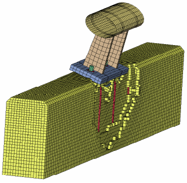 Figure 121. Illustration. Fracture profile of modified T4 system at 0.115 seconds. This is a view of the top and field side of the parapet which shows the deformed configuration at 0.115 second. The rail remains attached to the baseplate, but has rotated significantly relative to the top of the concrete parapet. The bulge previously visible at 0.08 second has been replaced by extensive erosion, about two to three element layers deep.