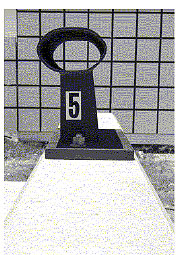 Figure 89. Photo. Parapet damage after test P5, side</strong>. This post-test view is a side view and reveals no damage or apparent deflection.