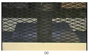 This collection of four photos shows the rapid progression of failure in a steam treated U H P C cylinder containing no fiber reinforcement. The cylinder is intact in photos (a) and (b). The cylinder is shattering in photo (c) and is mostly missing from the photograph in (d).