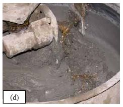 This series of five photos graphically depicts the stages in the mixing of U H P C as observed for all of the batches of concrete cast for this study. (a) shows the dry constituent materials in the pan mixer as the water is being added. (b) shows the U H P C in the mixer as the H R W A is added. (c) shows the U H P C before its conversion into a viscous paste. (d) shows the U H P C at the time of fiber addition. (e) shows the U H P C after mixing is complete.