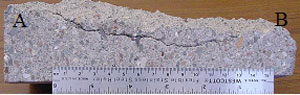 Figure 50. Photos. Section through region containing split face delamination. Photo c shows a side view of the section with the crack, labeled A-B.