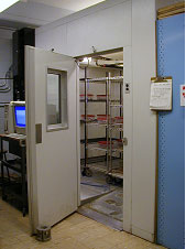 Figure 71. Photo. View of inside of walk-in freezer. Open freezer has numerous shelves for housing specimens.