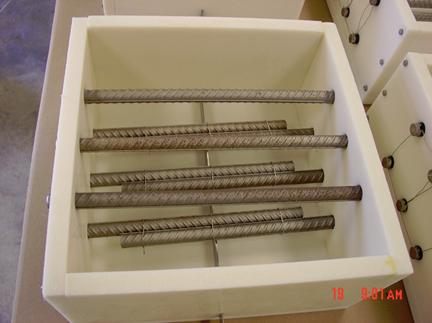 Figure 9. Photo. View of a mold for a CCRV-SMI specimen prior to concrete pouring. This is a photograph of a mold for a CCRV-SMI specimen prior to concrete pouring with rebars in place.