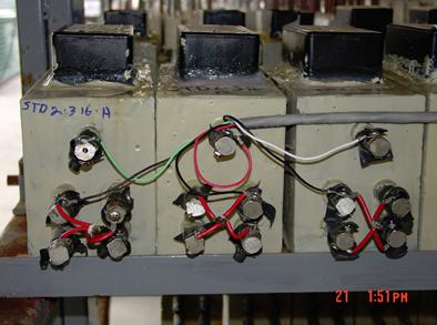 Figure 13. Photo. Three MS specimens under exposure. This is a photograph of three MS specimens under exposure.