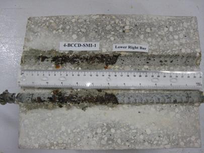 Figure 95. Photo. Lower R bar and bar trace of specimen 4-BCCD-SMI-1 subsequent to dissection. This is a photograph of a lower R bar and bar trace of specimen 4-BCCD-SMI-1 subsequent to dissection showing extensive corrosion.