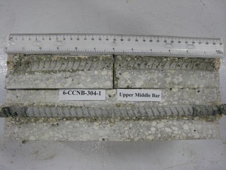 Figure 102. Photo. Top C bar and bar trace of specimen 6-CCNB-304-1 subsequent to dissection. This is a photograph of a top C bar and bar trace of specimen 6-CCNB-304-1 subsequent to dissection. No corrosion is apparent.