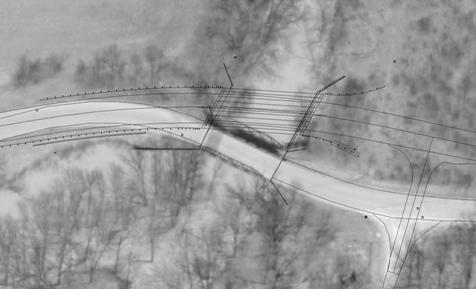 Photo showing an aerial view of the existing bridge site with the new Bowman Road Bridge plans superimposed. The new bridge is shown further up the stream at a different skew from the existing bridge. The road alignment is therefore changed. Trees are located around the site.
