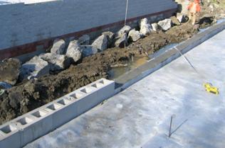 This photo shows the grout-filled facing block within the bearing area zone before construction of the setback and beam seat.