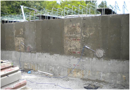 Photo. Pressure cells behind back wall on Tiffin River Bridge. Click here for more information.