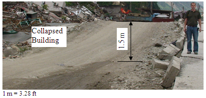 Photo. Surface Rupture Along the Old Highway Near a Collapsed Building. Click here for more information.