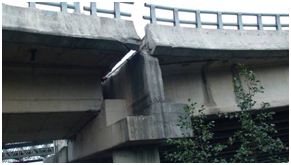 Photo. Exterior face of westbound ramp to Llacolen bridge at the river end. Click here for more information.