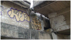 Photo. Interior face of westbound ramp to Llacolen bridge at the river end. Click here for more information.