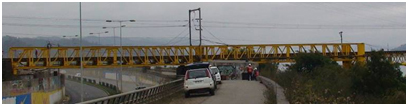 Photo. North end of Chepe railroad bridge over roadway. Click here for more information.