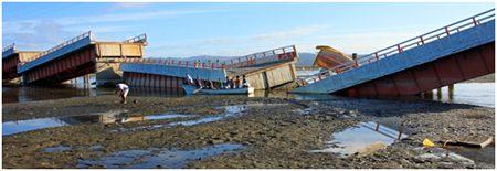 Photo. Tubul bridge collapsed spans and substructure. Click here for more information.