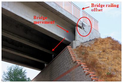 Photo. Bridge supported on footing on top of block-faced geogrid wall at Estribo Francisco Mostazal. Click here for more information.