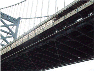 This photo shows a steel bridge on which a train is crossing. The crossing train caused a strain event that was captured by the wireless data collection system.