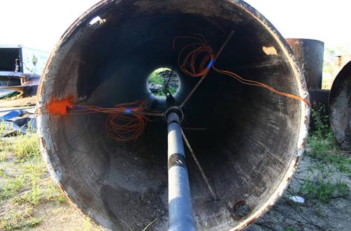 This photo shows voided shaft thermocouple (TC) wires inside the centered access tube in the supporting struts. The orange wires are part of the preparation for shaft construction.