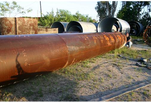 This photo shows additional thermocouples (TCs) mounted to the exterior of the central casing attached to welded tabs at the desired locations. The exterior of the casing represents the inner-most portion of the concrete that was to be placed around the casing. All TC wiring was extended to the top of the casing for later installation to the data collection system.