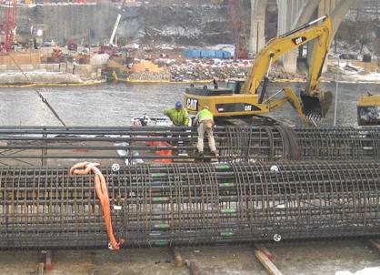 The photo shows the shaft reinforcement cage being constructed. The cages for pier 2 were fabricated along the excavation site. Pier 2 southbound and northbound cages were fabricated in the same area.