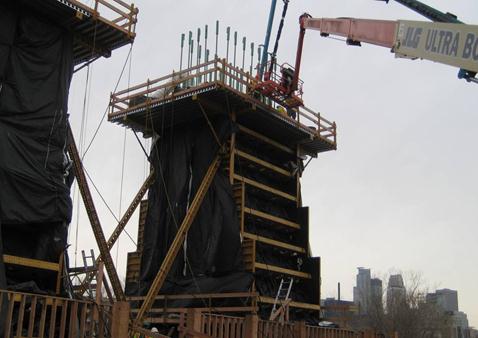This photo shows reinforcement at the midsection of one of the columns for the I-35W bridge. The midlevel of the columns were cast in preconstructed forms that were set in place and supported. Connections for the rebar to the upper level extend out of the interior column portion of pier 2 (southbound).
