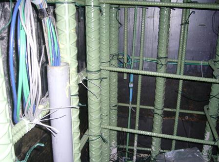 The photo shows the gauge wires exiting the conduit. All wires from the midlevel gauges were routed through the conduit provided to the base of the column where the data loggers were temporarily mounted.